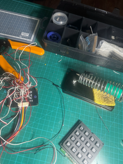 Desk, soldering iron, wires, keypad and LCD display