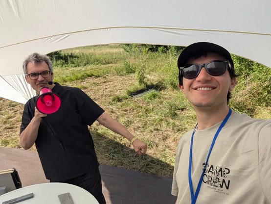 Selfie with Michael while he talks in a pink megaphone.