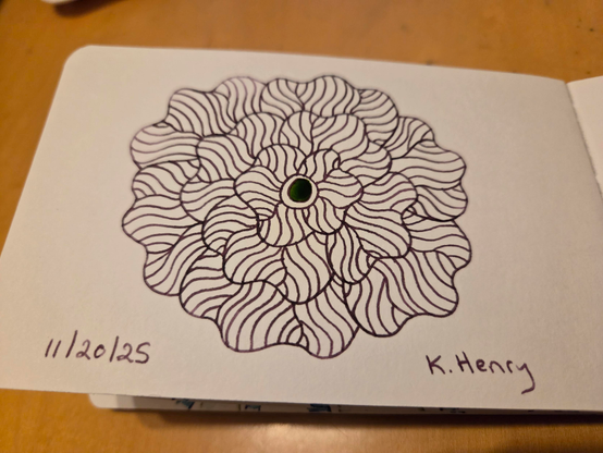 Hand drawn generative/procedural art in ink on an open page of my sketchbook. The abstract pattern is floral.