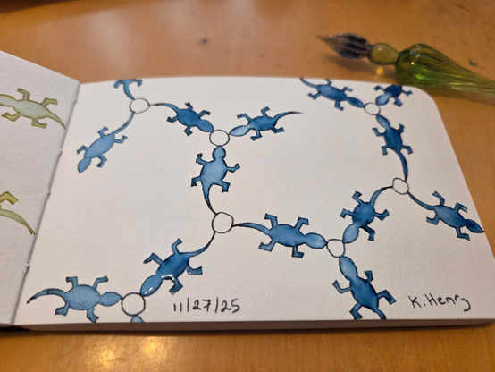 Hand drawn generative/procedural art in ink on an open page of my sketchbook. The abstract pattern looks a bit like a chemistry diagram, but with lizard shapes instead of straight lines.