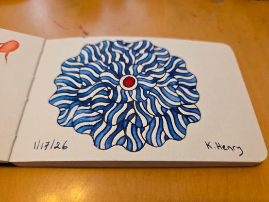 Hand drawn generative/procedural art in ink on an open page of my sketchbook. The abstract pattern is floral.