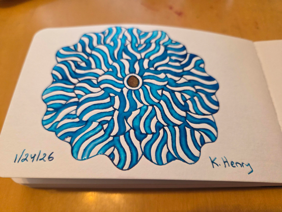 Hand drawn generative/procedural art in ink on an open page of my sketchbook. The abstract pattern is floral.