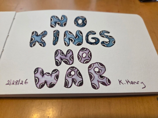 Hand drawn generative/procedural art in ink on an open page of my sketchbook. The pattern is made from puffy with polka dots that reads "No Kings No War"