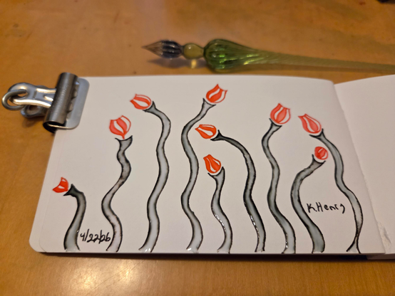 Hand drawn generative/procedural art in ink on an open page of my sketchbook. The abstract pattern looks a bit like some wavy stems with little flower bud at the tops. There is a binder clip holding my sketchbook open, and my glass dipping pen is next to it.