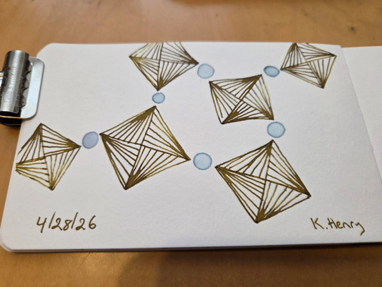 Hand drawn generative/procedural art in ink on an open page of my sketchbook. The abstract pattern has a bunch of squares with circles between the corners, like beads on a string. Kinda. It's difficult to describe.