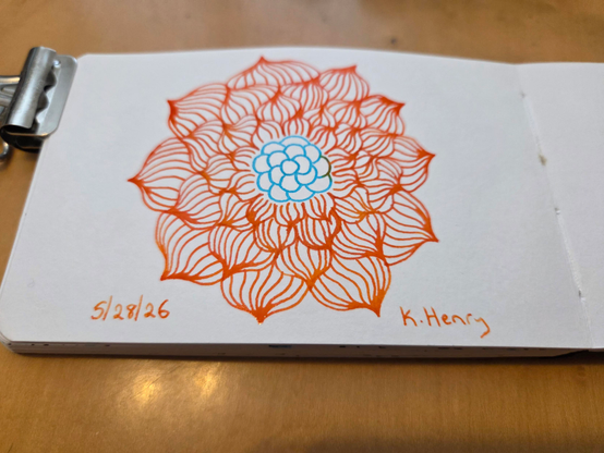 Hand drawn generative/procedural art in ink on an open page of my sketchbook. The abstract pattern is floral.