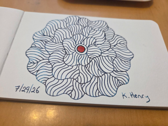 Hand drawn generative/procedural art in ink on an open page of my sketchbook. The abstract pattern is floral.