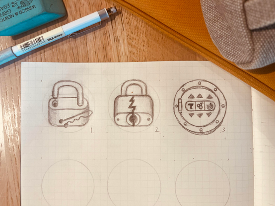 Closeup of a notebook with grid paper on a wooden table showing 3 pencil icon sketches: 

1. an opened padlock with a hairpin.

2. a cracked closed padlock.

3. a circular vault door with a hinge on the left. the cover shows a fruit machine: "7 🍒 🍌"