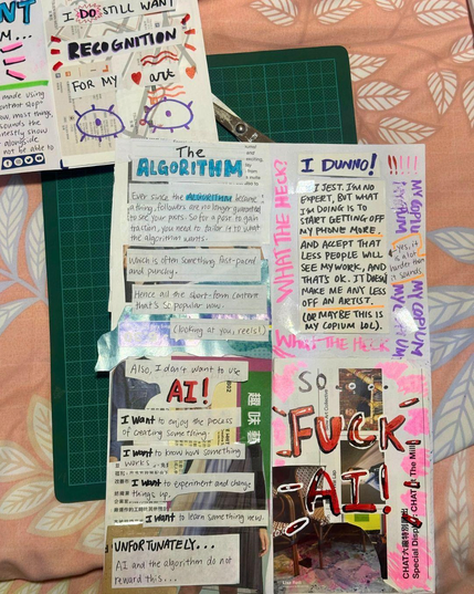 Behind the scenes of making the 'Social Media sucks for artists' zine. Page has a scissor behind it as well as a green cutting mat. This is placed on a pink blanket with white leaves.