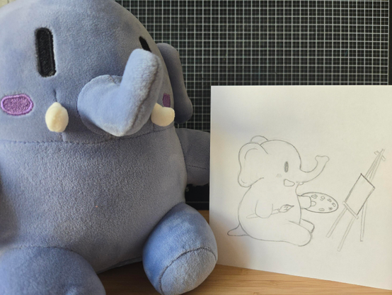 A photo of Plustodon. Next to it is a drawing. On the drawing is Plushtodon with paint and brush looking at an empty canvas.