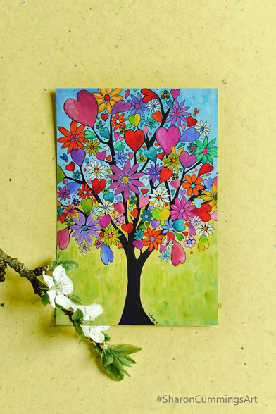 Colorful painting of a tree with hearts and flowers by artist Sharon Cummings.