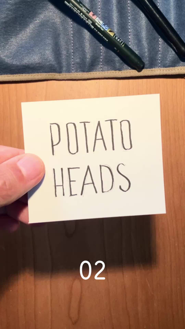 top-down time lapse video of me drawing a face into a coloured, pink blob on a small piece of paper. This time the blob has a pear shape.