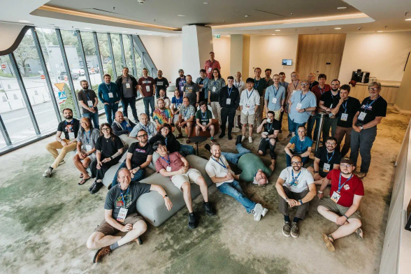Group photo of the attendees of the 2026 Python Language Summit. Notably, Larry Hastings is laying flat on the ground with his eyes closed.